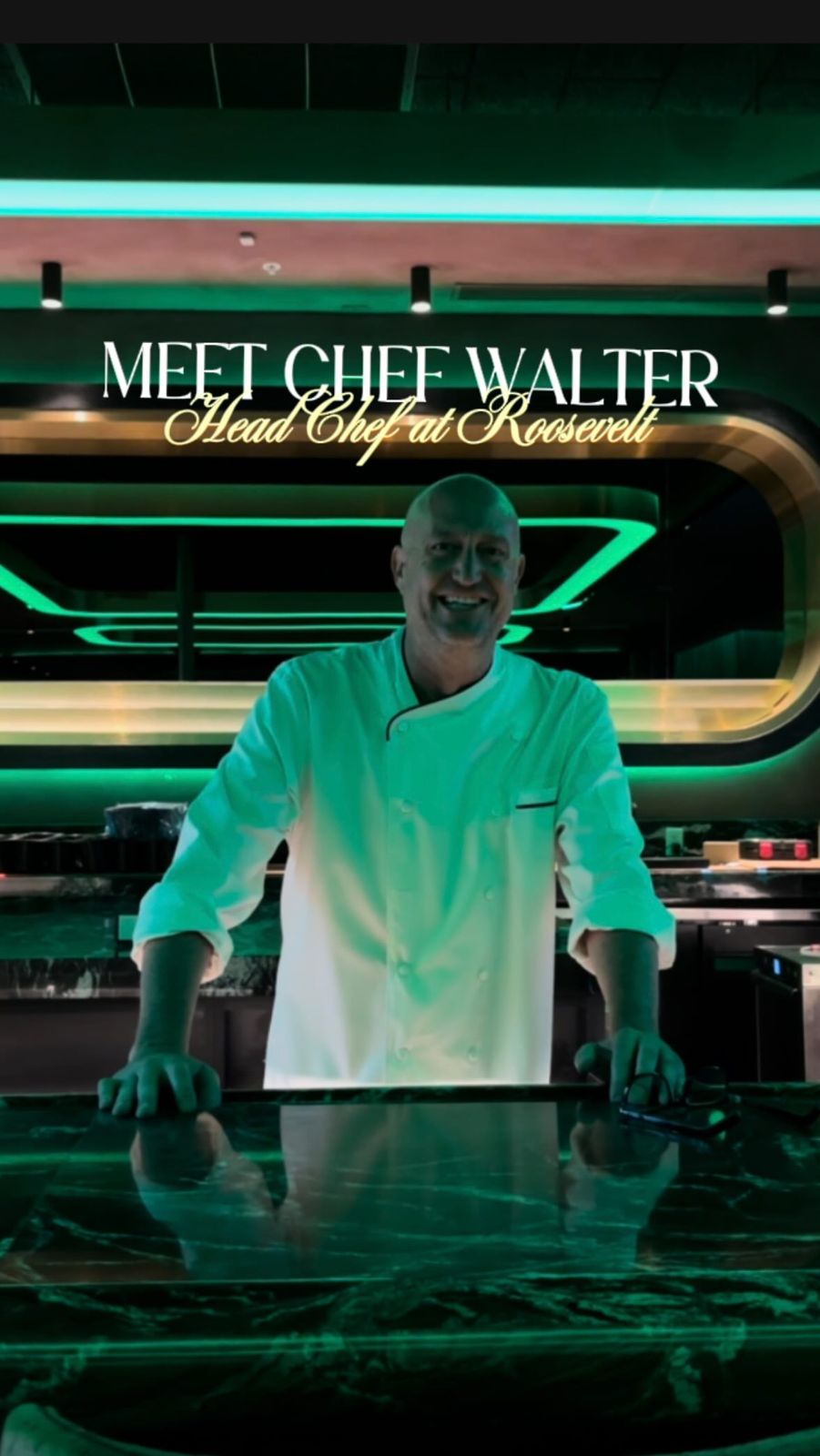 Chef Walter in the Roosevelt kitchen under green light