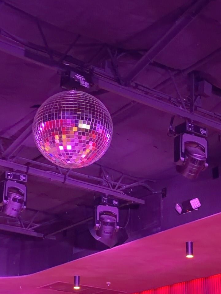 Mirror ball and stage rig in pink light